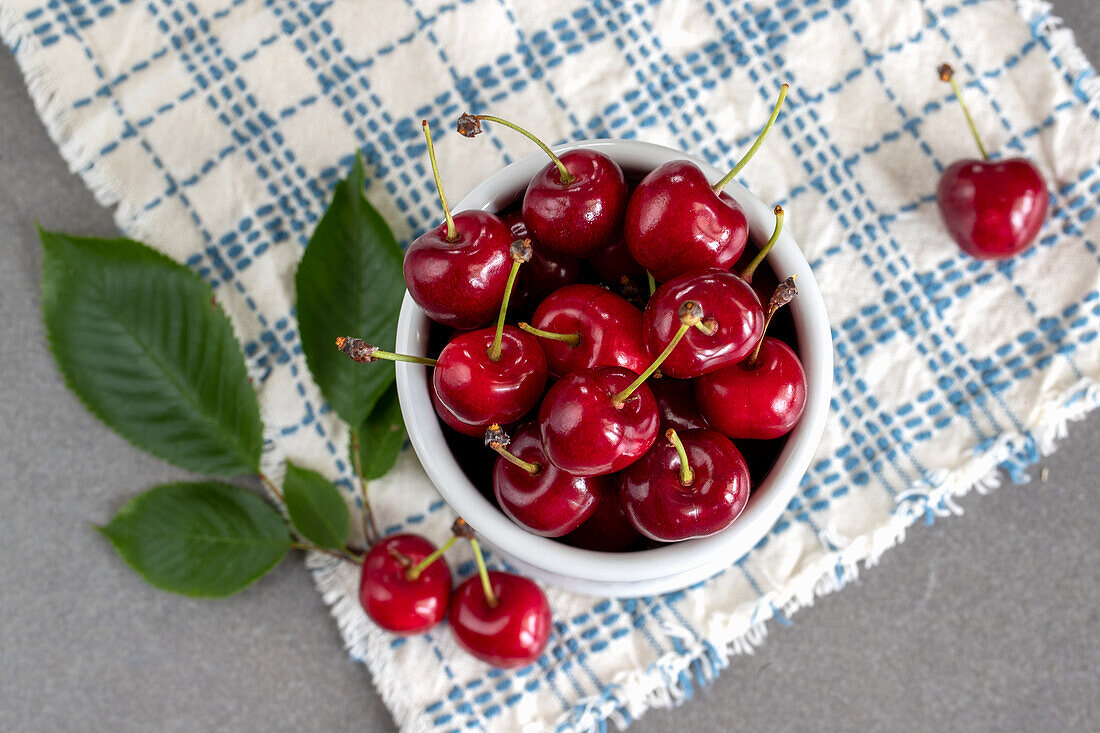 Red cherry in a small bowl