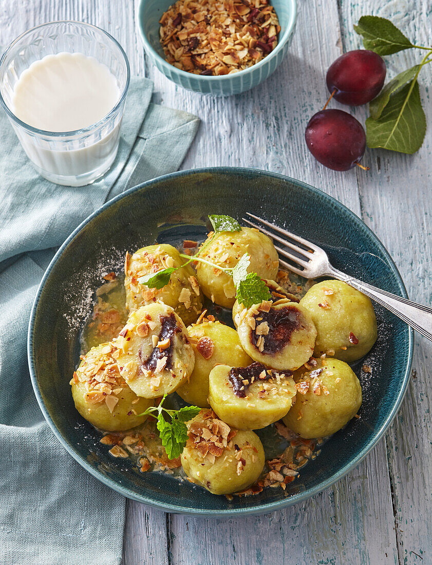 Sweet potato dumplings filled with plum jam and crumble