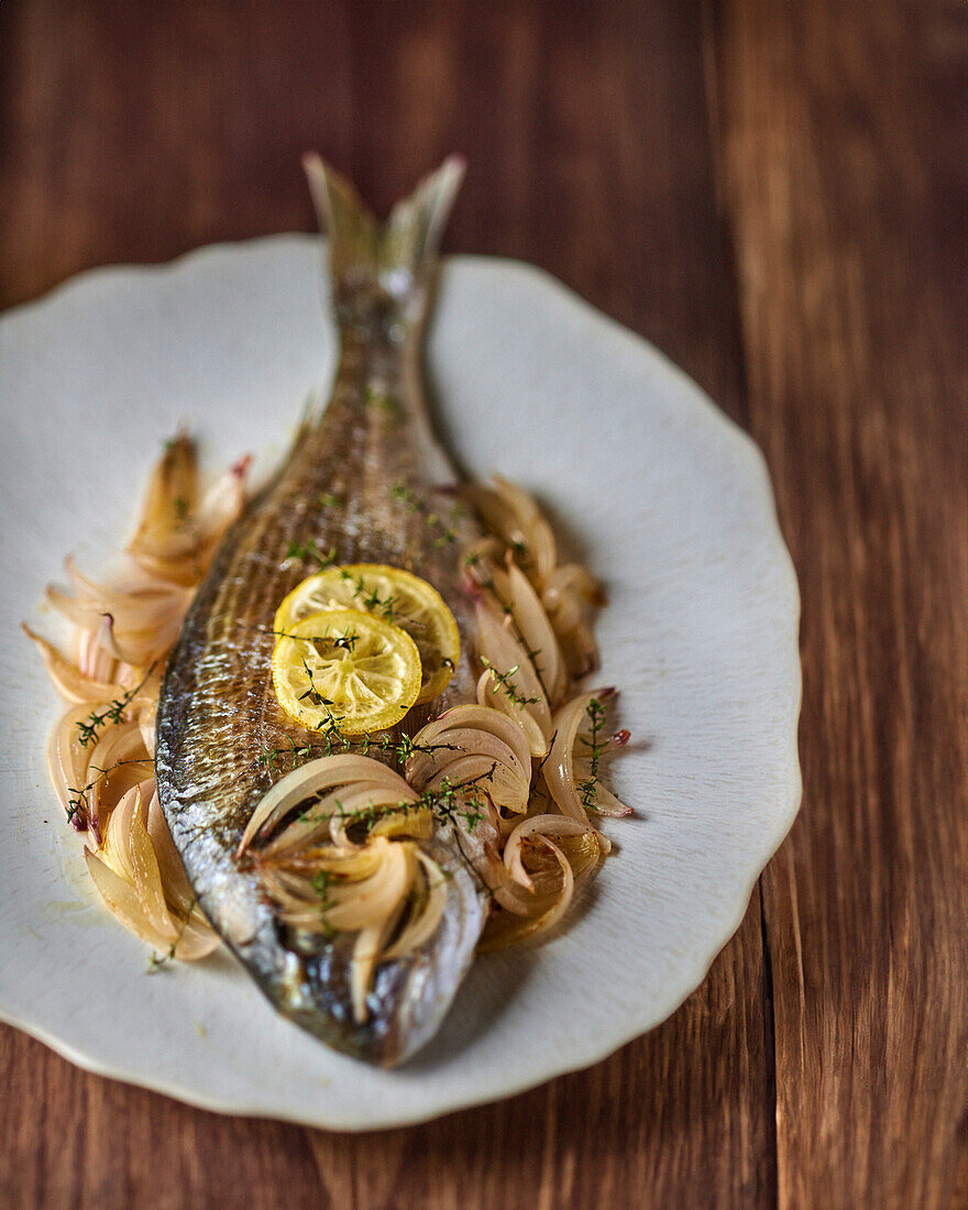 Sea bream with sautéed onions