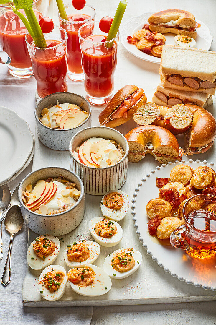 Brunch buffet with overnight oats, eggs, bagels and Bloody Mary