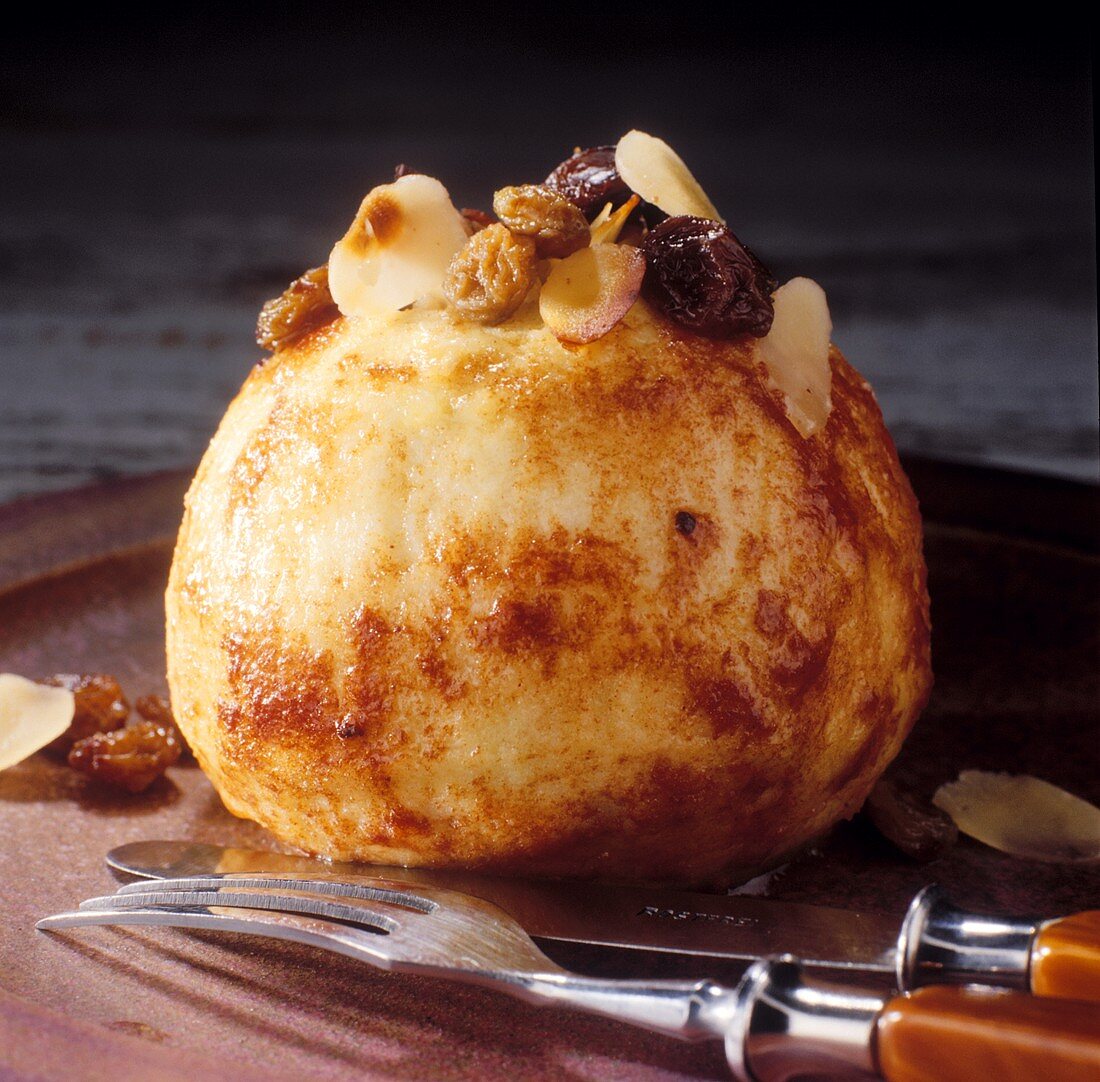 Baked apple with raisin and almond filling