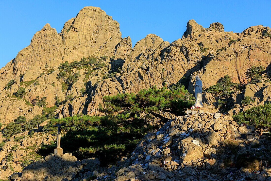 France,Corse du Sud,Quenza,Col de Bavella,Our Lady of the Snow,white virgin of Alta Rocca,Needles of Bavella in the background