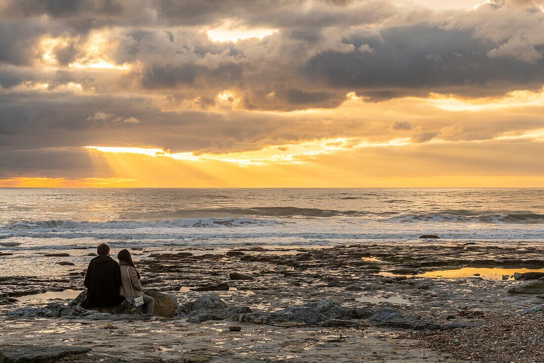 France,Pas de Calais,Opal Coast,Ambleteuse,a loving couple facing the sunset