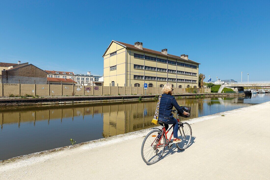 France,Meurthe et Moselle,Nancy,apartment building and old factory building along the Meurthe canal