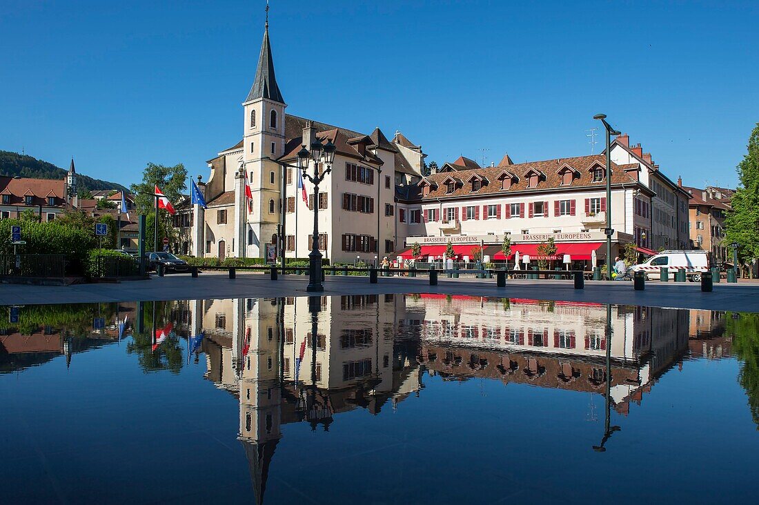 France,Haute Savoie,Annecy,the Saint Francois church is reflected in the mirror fountain of the Place de l'Hotel de Ville