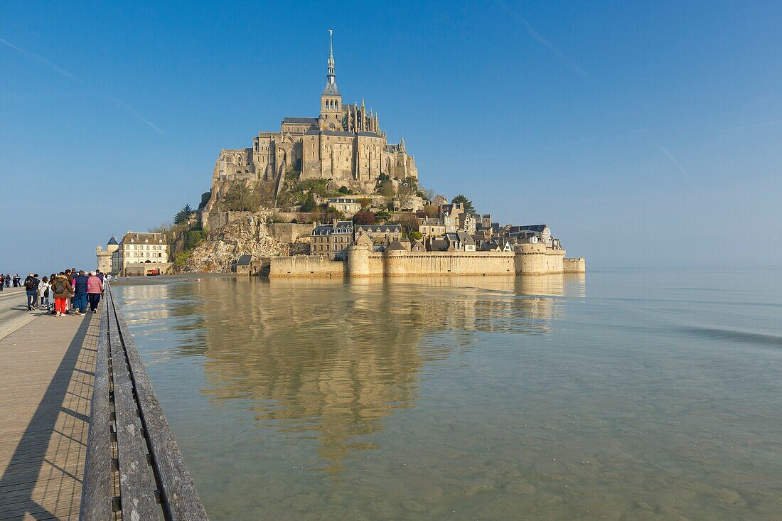 France,Manche,Mont Saint Michel bay listed as World Heritage by UNESCO,Mont Saint Michel at high tide and footbridge by architect Dietmar Feichtinger