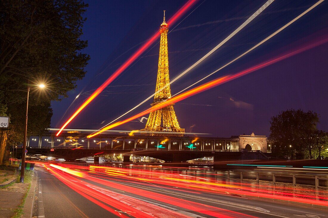 France,Paris,area listed as World Heritage by UNESCO,the Eiffel Tower (© SETE-illuminations Pierre Bideau) and the Bir-Hakeim bridge at night
