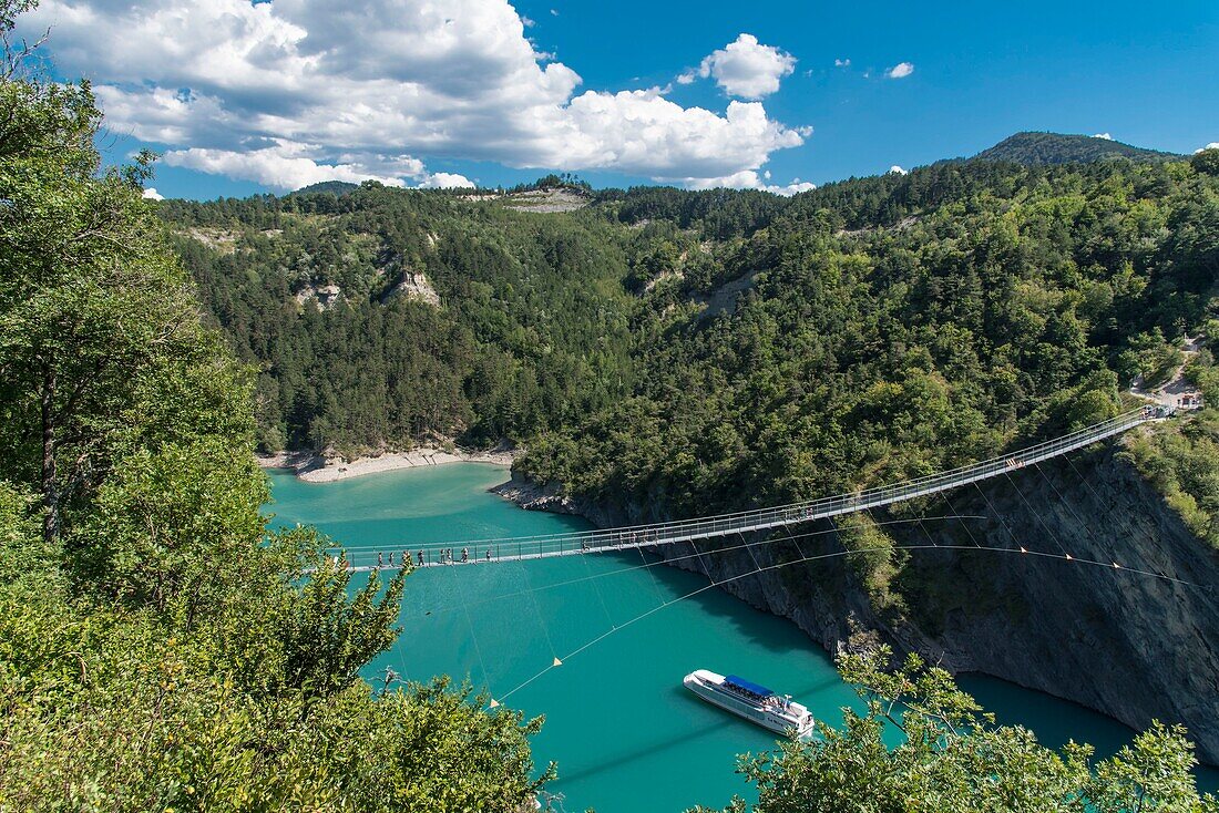 France,Isere,Trieves,Monteynard Lake,footbridge hiking trail,Ebron footbridge and Mira boat