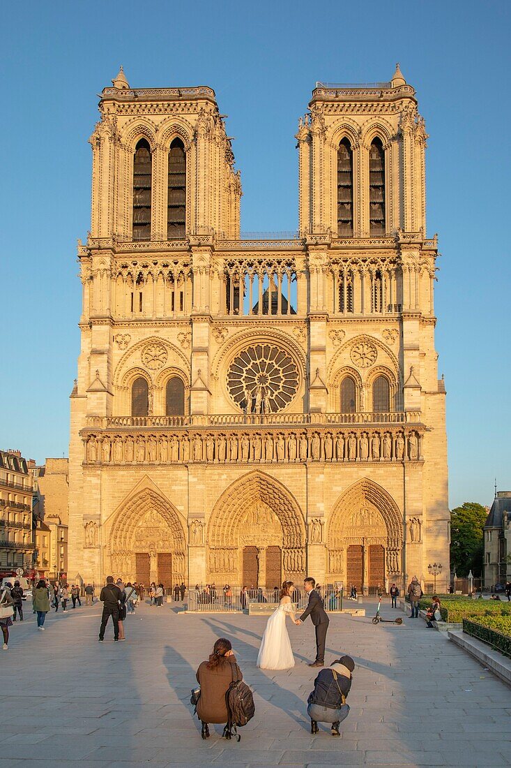 France,Paris,UNESCO World Heritage Site,Chinese newlyweds in photo session in front of the Notre-Dame de Paris cathedral