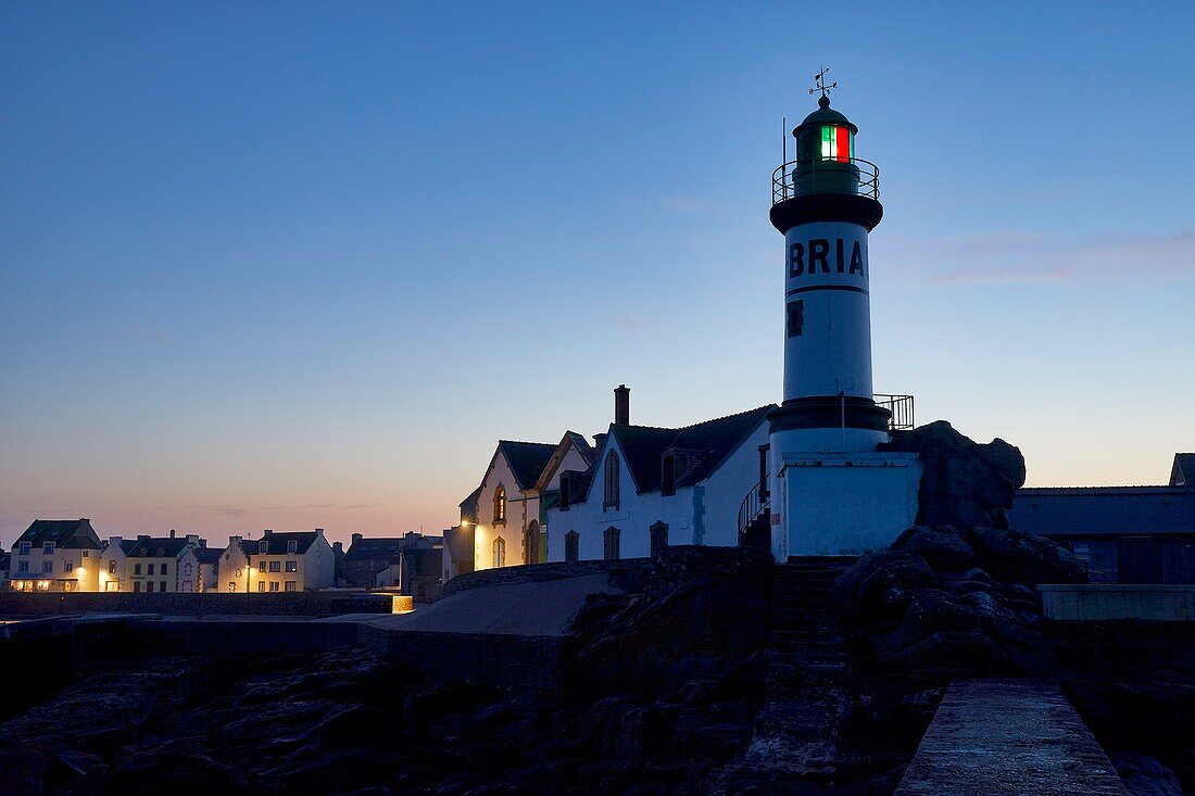 France,Finistere,Iroise Sea,Iles du Ponant,Parc Naturel Regional d'Armorique (Armorica Regional Natural Park),Ile de Sein,labelled Les Plus Beaux de France (The Most Beautiful Village of France),the Men-Brial lighthouse at nightfall