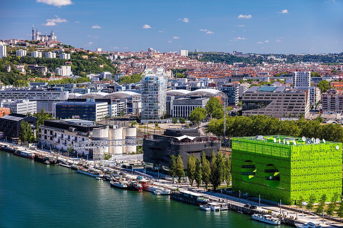 France,Rhone,Lyon,district of La Confluence in the south of the peninsula,first French quarter certified sustainable by the WWF,view of the quai Rambaud along the old docks with the Green Cube,the Sucriere,the Ycone tower and Notre Dame de Fourviere Basilica