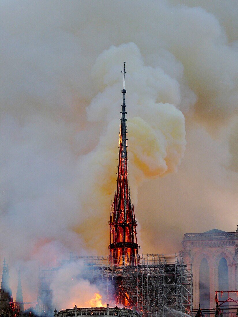 [ Unpublished - Exclusive ] France,Paris,area listed as World Heritage by UNESCO,Notre Dame Cathedral of 14th century Gothic architecture during the fire of 15th April 2019,close-up on the incandescent frame of the spire before his impending downfall