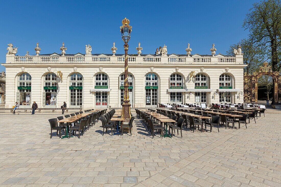 France,Meurthe et Moselle,Nancy,Stanislas square (former royal square) built by Stanislas Leszczynski,king of Poland and last duke of Lorraine in the 18th century,listed as World Heritage by UNESCO,terrace,Petit Pavillon (Small Pavillion),street lamp by Jean Lamour and fountain Amphitrite (1751) by Barthelemy Guibal,railings and iron works by Jean Lamour