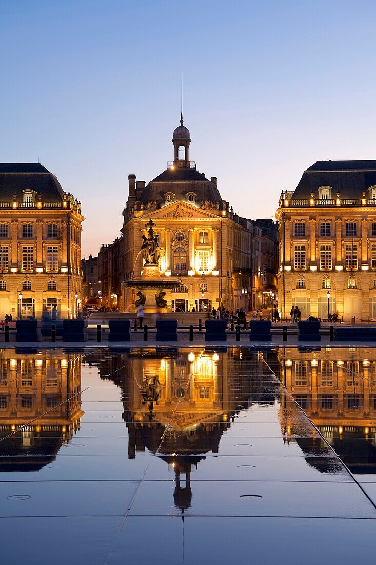 France,Gironde,Bordeaux,area listed as World Heritage by UNESCO,Saint Pierre district,Place de la Bourse (Square of Bourse),the reflecting pool from 2006 and directed by Jean-Max Llorca hydrant and the three graces fountain