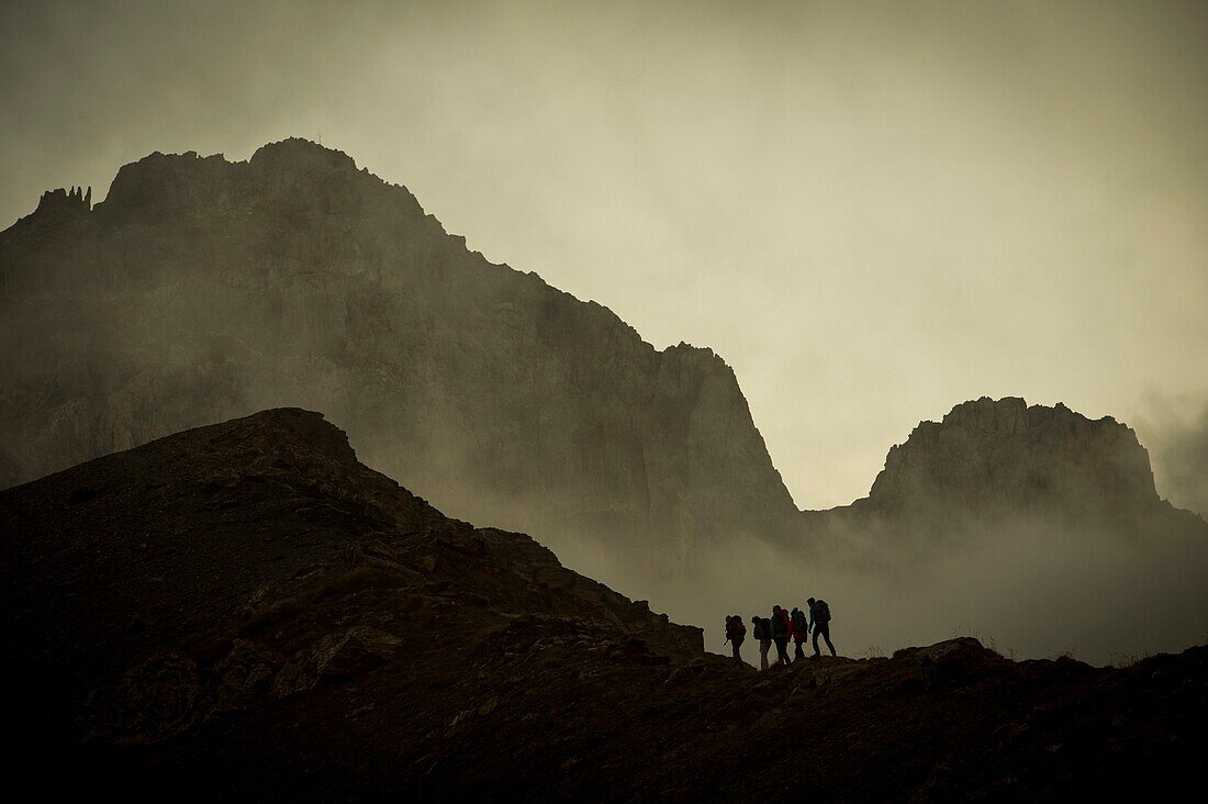 France,Savoie,Valloire,massif des Cerces,cycling ascension of the Col du Galibier,one of the routes of the largest bike domain in the world,view towards the great Galibier and group of hikers