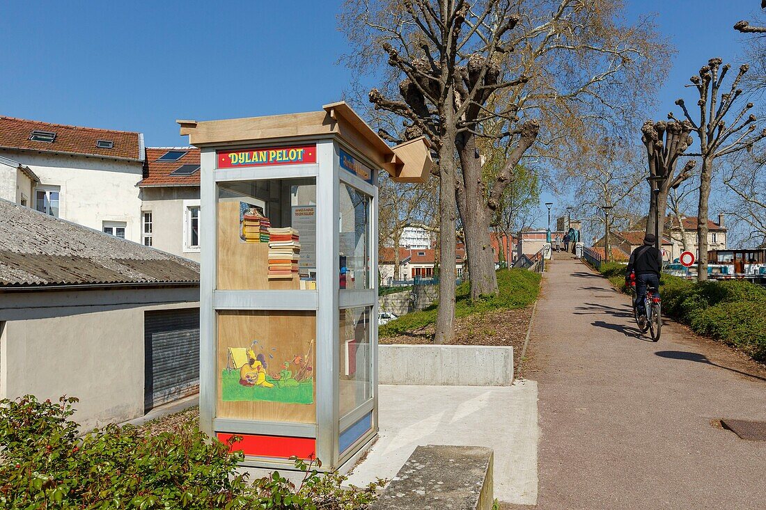 France,Meurthe et Moselle,Nancy,former telephone booth converted into a book tree in the memory of Dylan Pelot a local figure in the field of culture in Lecreux street by the Meurthe canal