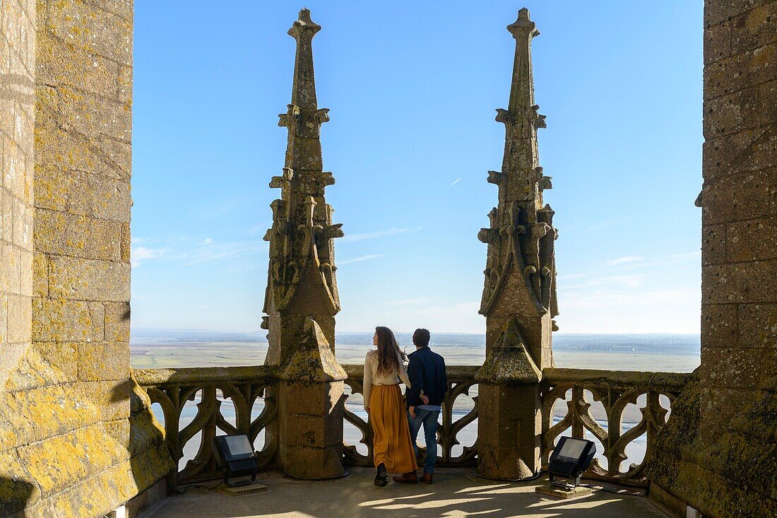 France,Manche,the Mont-Saint-Michel,couple admiring the view from outside the church