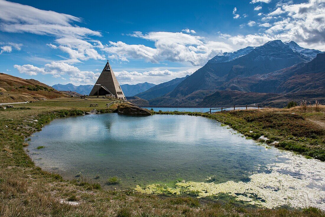 France,Savoie,Haute Maurienne,Val Cenis,Mont Cenis Pass,the building of the Pyramid Plan Fontainettes,a pond and the dam lake