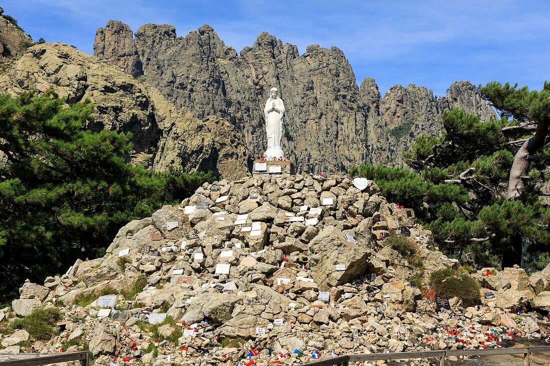 France,Corse du Sud,Quenza,Col de Bavella,Our Lady of the Snow,white virgin of Alta Rocca,Needles of Bavella in the background