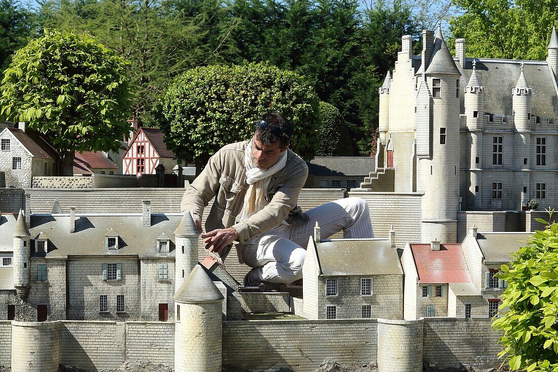 France,Indre et Loire,Loire valley listed as World Heritage by UNESCO,Amboise,Mini-Chateau Park,Guy Perier art maquetist in front of the model of the city of Loches