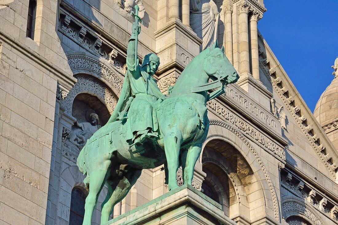 France,Paris,Montmartre,Sacre Coeur basilica,designed by architect Paul Abadie and completed in 1914,St Louis equestrian statue by sculptor Hippolyte Lefebvre