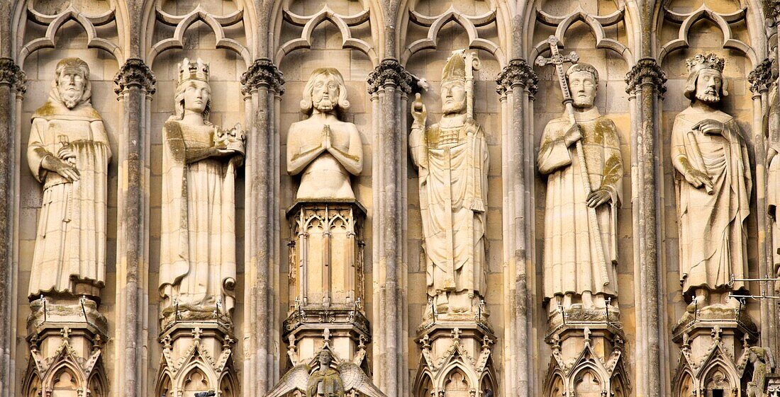 France,Marne,Reims,Notre Dame de Reims cathedral,listed as World Heritage by UNESCO,the western façade,Baptism of Clovis (center) by the Bishop Saint Remi,in the presence of Clotilde,his wife and inspiration of his conversion,the Bishop assistants and of the hermit Montan