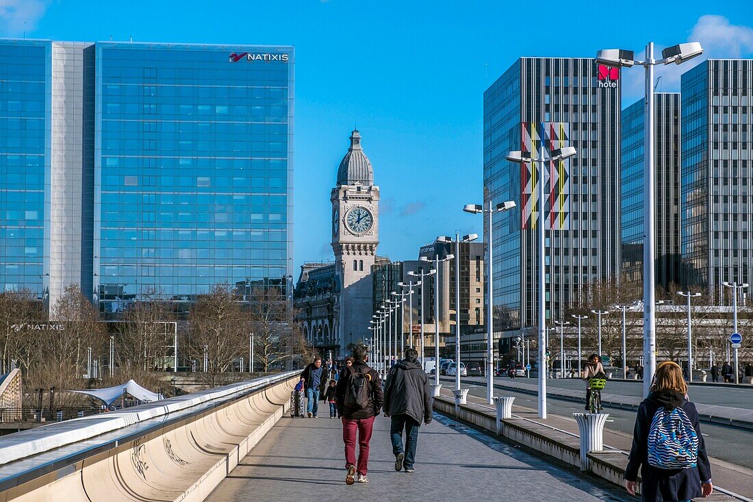 France,Paris,Pont Charles de Gaulle by architects Louis Gerald Arretche and Roman Karansinski and business district of Gare de Lyon,Tour de l'Horloge (Clock Tower) in the background