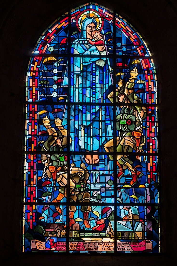 France,Manche,Cotentin,Sainte Mere Eglise,stained glass showing the Virgin Mary surrounded by parachutists in memory of the D day landings