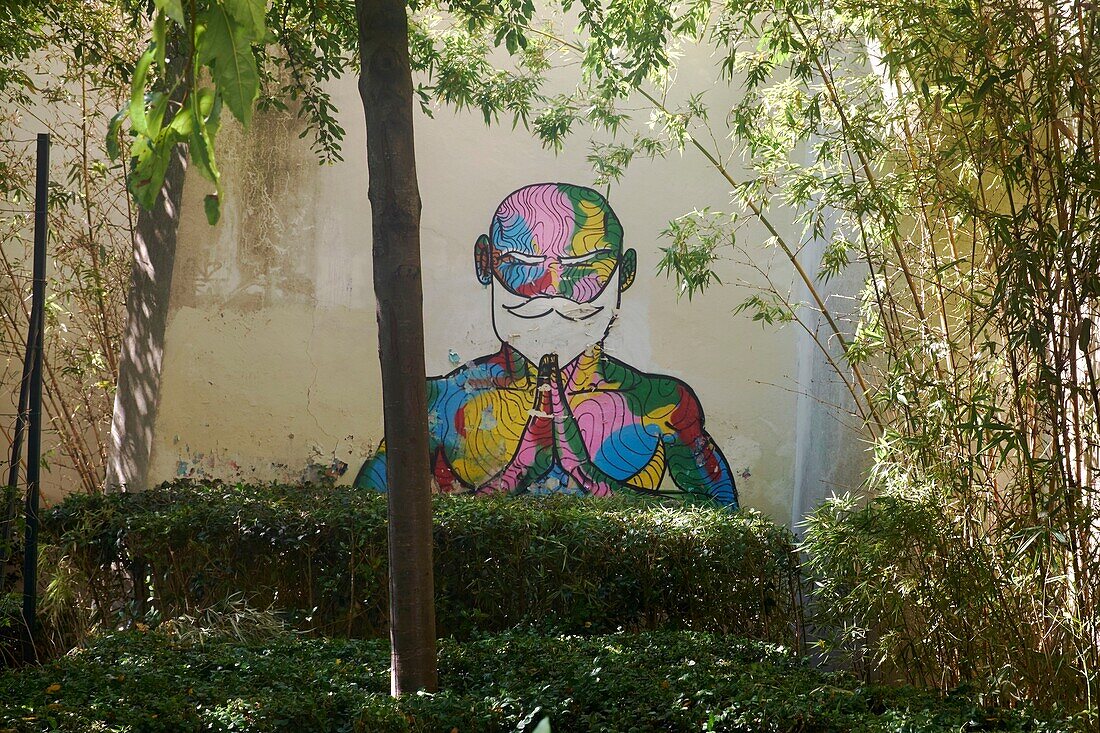 France,Paris,mural painting representing of a monk meditating in a small garden at the corner of rue d'Aboukir and rue des Petits Carreaux