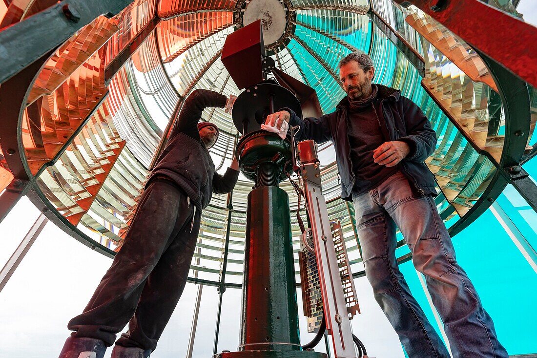 France,Gironde,Verdon sur Mer,rocky plateau of Cordouan,lighthouse of Cordouan,listed as World Heritage by UNESCO,lighthouse keeper cleaning the Fresnel lens from the lantern