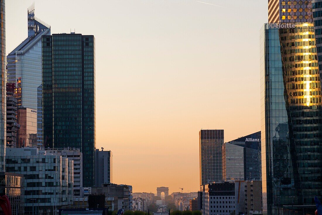 France,Hauts de Seine,La Defense,the buildings of the business district,the Arc de Triomphe in the background