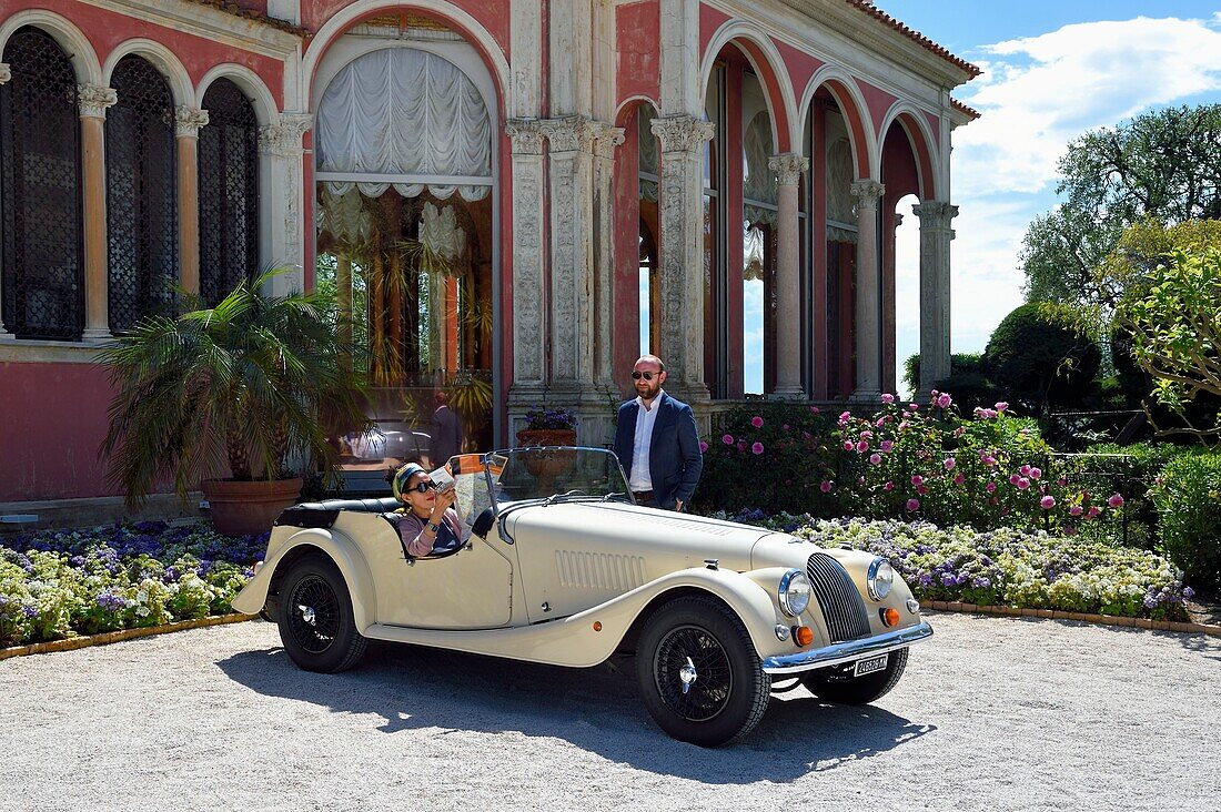 France,Alpes Maritimes,Saint Jean Cap Ferrat,Morgan Roadster 4/4 vintage car in front of the Ephrussi de Rothschild villa
