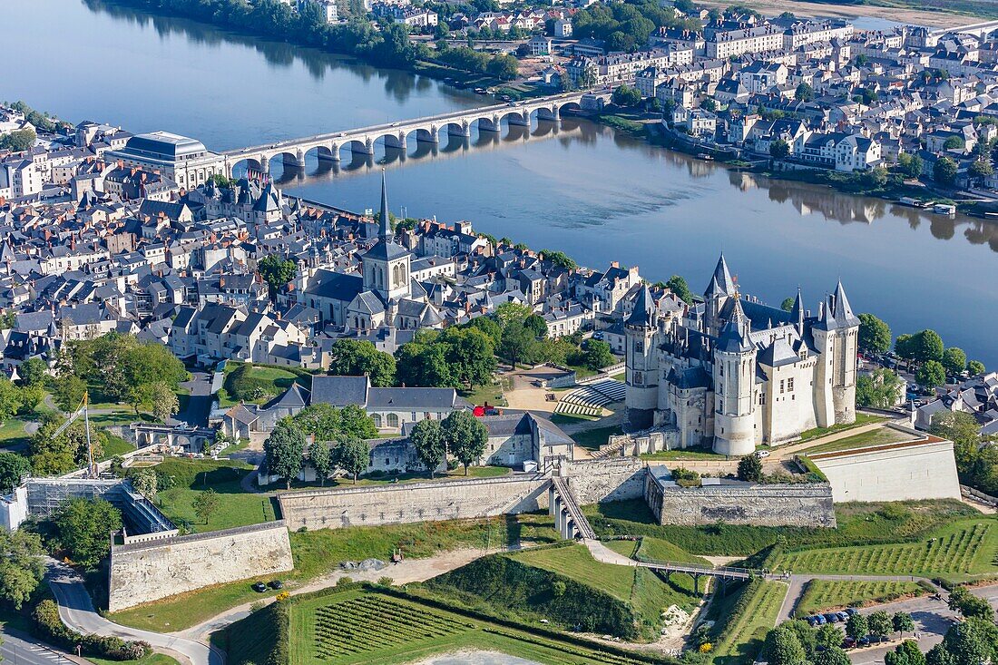France,Maine et Loire,Loire valley listed as World Heritage by UNESCO,Saumur,the town and the castle near the Loire river (aerial view)