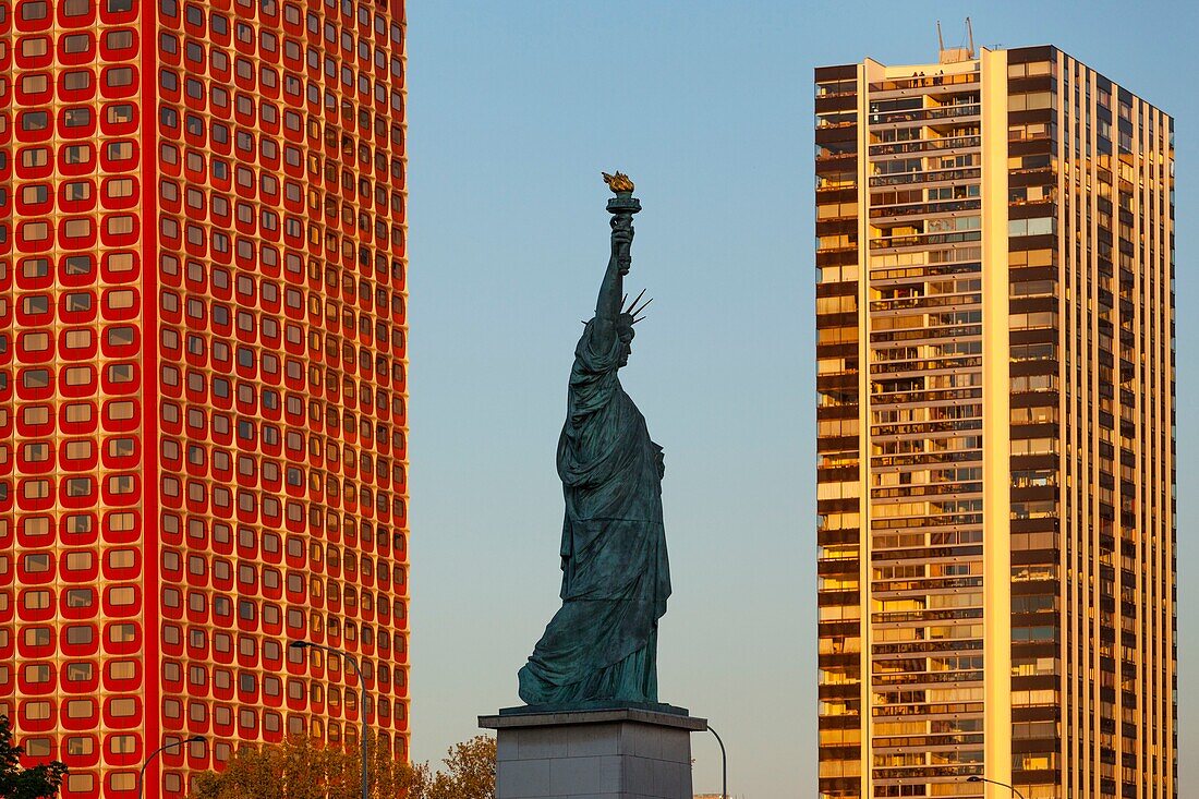 France,Paris,the banks of the Seine,the buildings of the Beaugrenelle district,the island of the swans with the Statue of Liberty