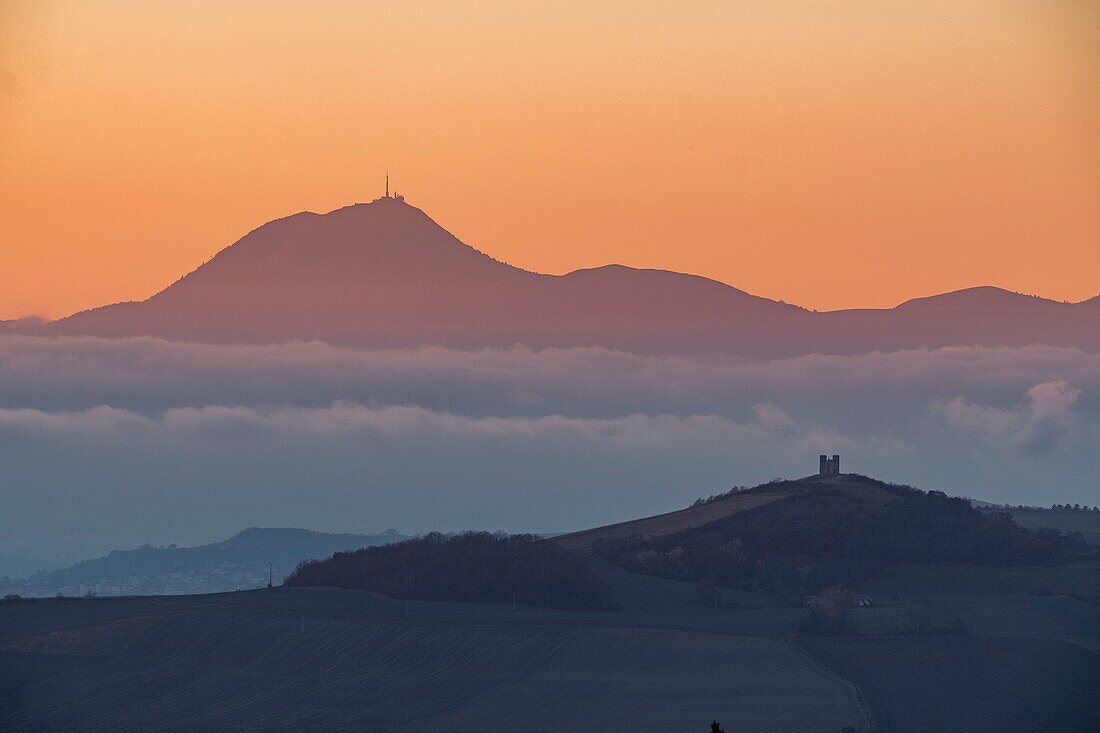 France,Puy de Dome,the Chaine des Puys,area listed as World Heritage by UNESCO,Regional Natural Park of the Auvergne Volcanoes,in the foreground puy of Turluron and Notre Dame de la Salette near Billom
