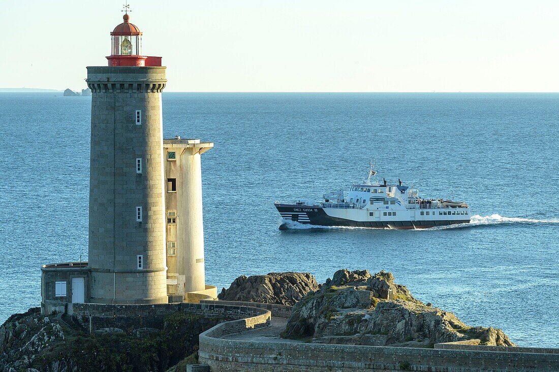 France,Finistere,the lighthouse of the Petit Minou at sunset and the boat Enez Eussa III