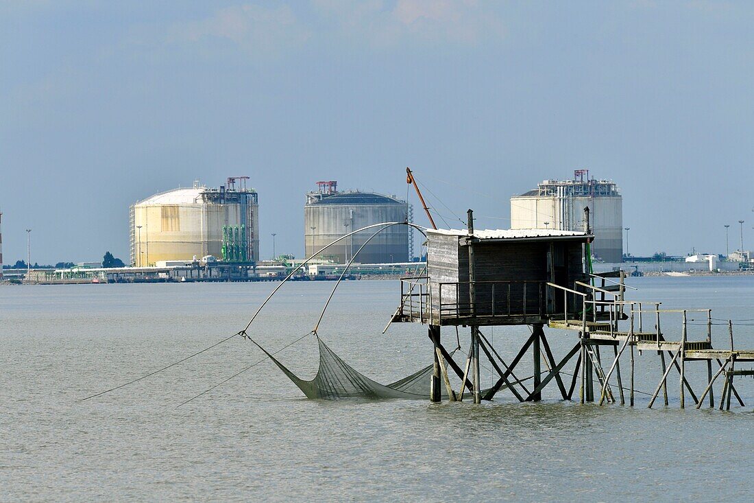 France,Loire Atlantique,Pays de la Loire,Saint Brevin les Pins,fisheries in the estuary of the Loire,fishermen huts and harbour of Saint-Nazaire in the background