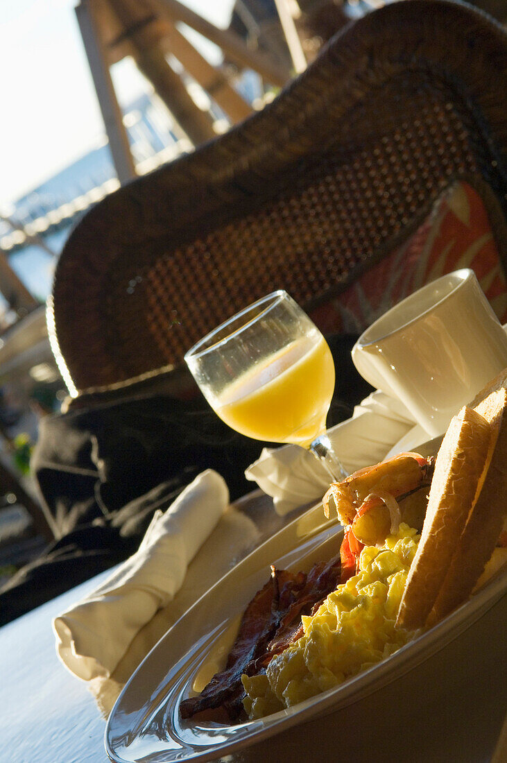 USA,Florida,Florida Keys,orange juice and coffee,Islamorada,toast,fingerling potatoes,bacon,Typical American breakfast of scrambled eggs