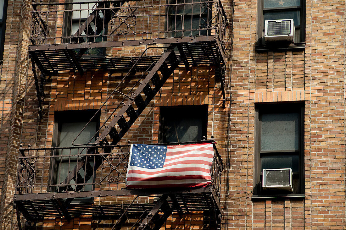 American Flag Outside An Apartments Building In Chelsea,Manhattan,New York,Usa