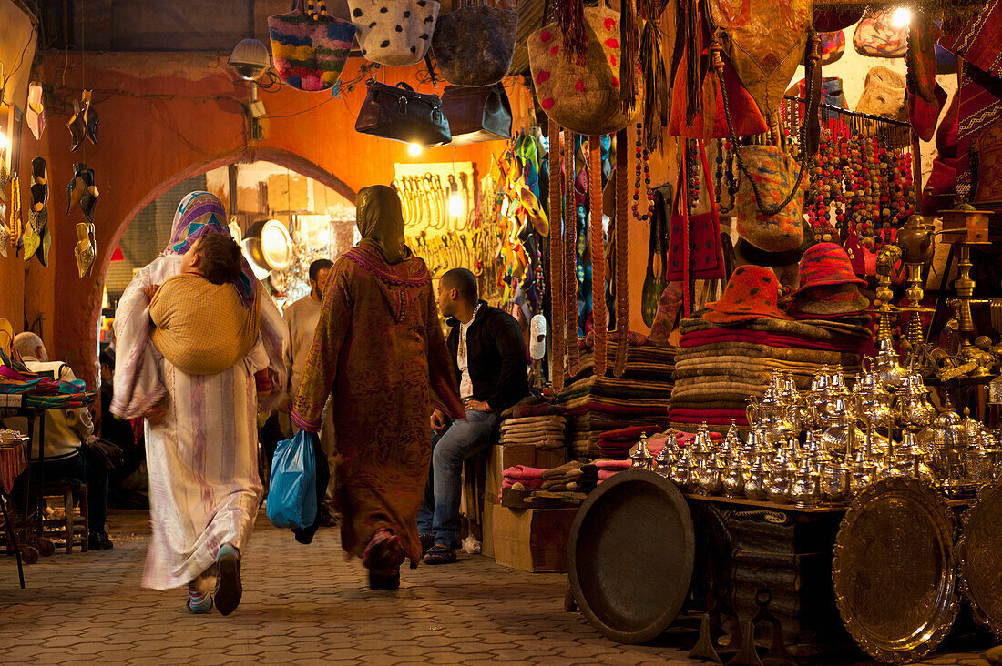 Morocco,Women walking through souk,Marrakesh