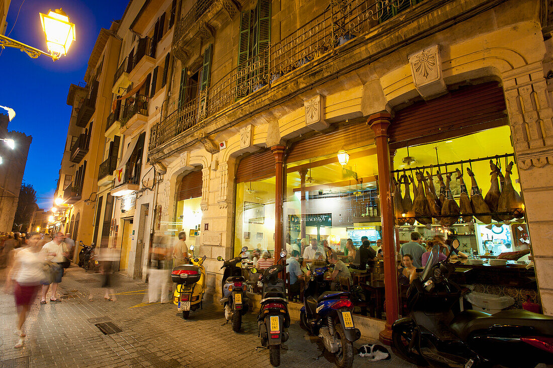 Spain,Majorca,People in cafes and restaurants at dusk,Palma