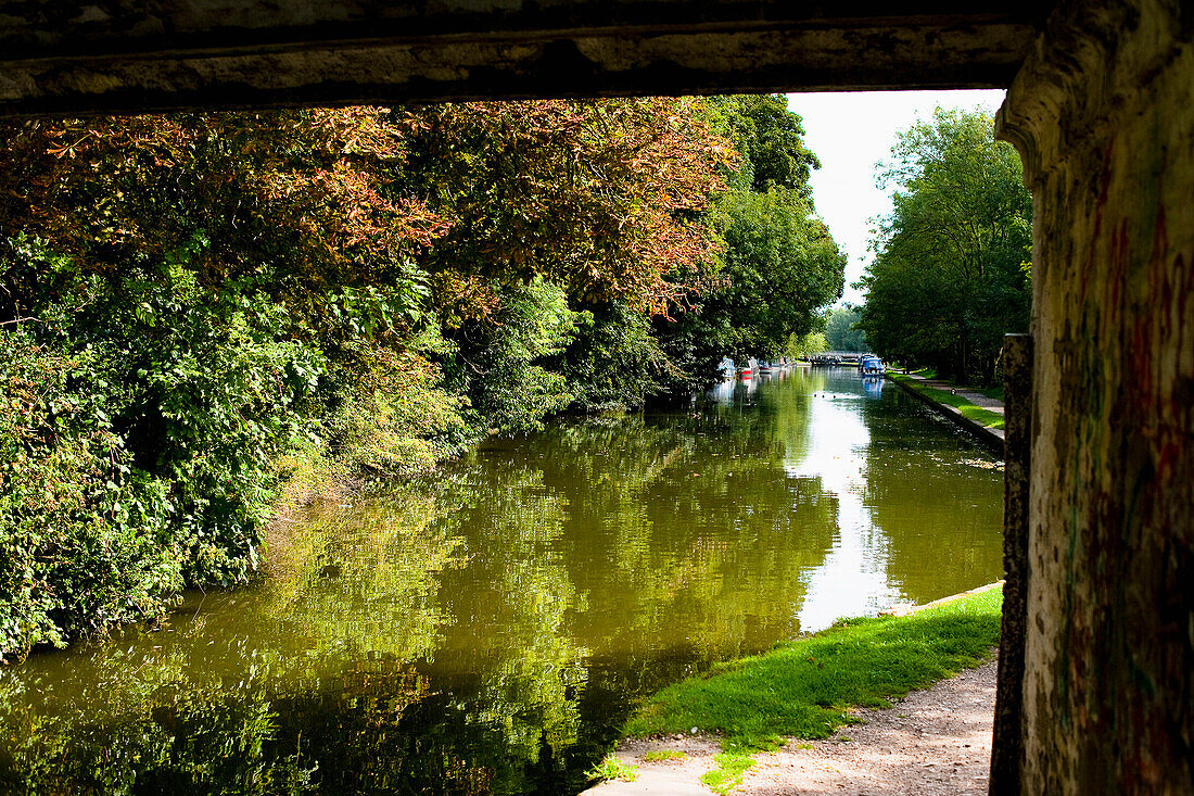 UK.,Hertfordshire,and lush green surrounding countryside. viewed from under a bridge,Hemel Hempstead,barges,towpath,The Grand Union Canal
