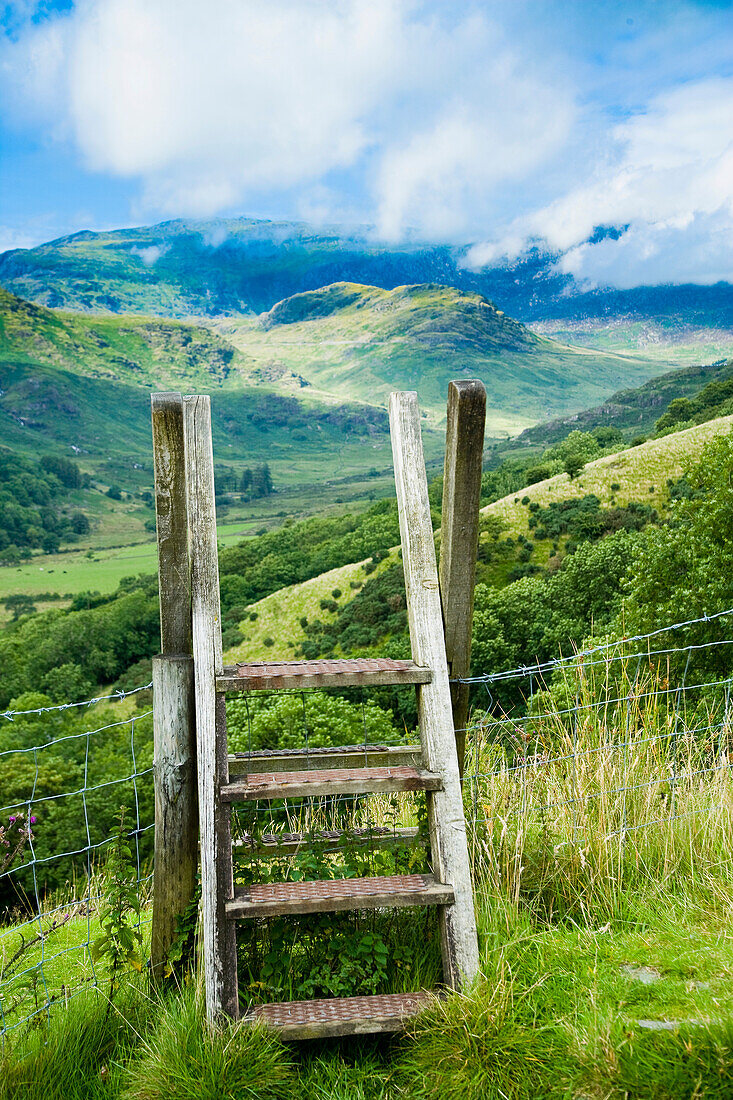 UK,North Wales,Snowdonia National Park,on country trail,Nantgwynant,Style over fence