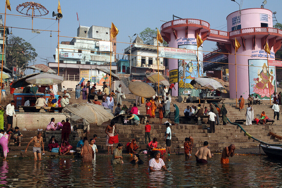 Praying and taking to the holy waters at Dashashwamedh Ghat the most famous and central bathing ghat. The culture of Varanasi is closely associated with the River Ganges and the river's religious importance.It is 'the religious capital of India'and an imp