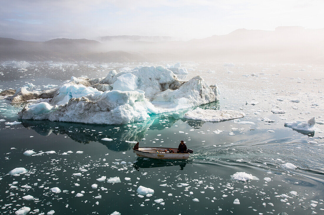 Greenland,Icefjord,Ilulissat,Fishermen going out to sea at Unesco World Heritage Site