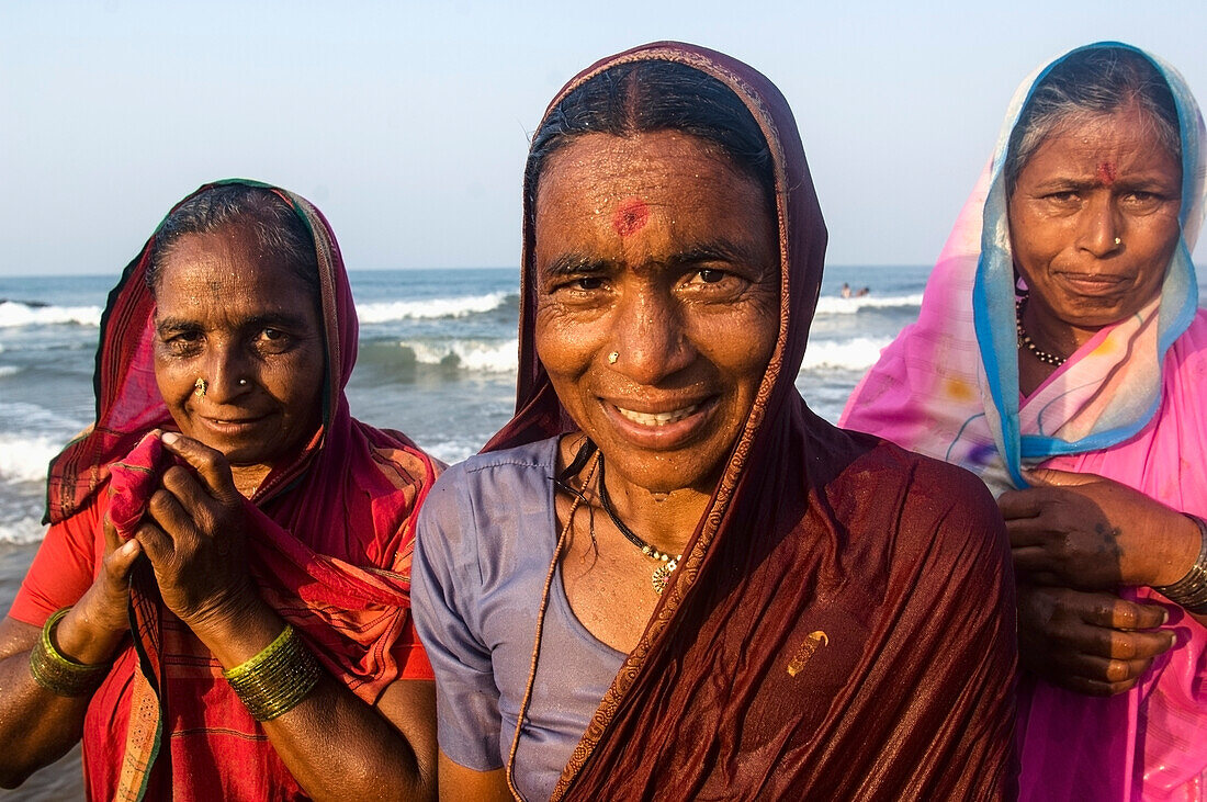 India,Karnataka,Three Woman Refreshing By Sea After Pilgrimage,Gokarna