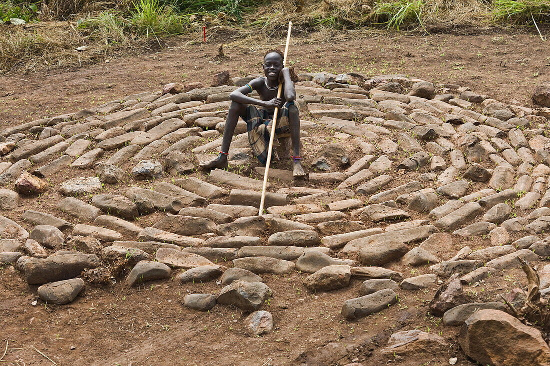 Ethiopia,South Western Ethiopia,Omo Valley,Southern Mursiland,Portrait of Mursi boy,Dirikoro