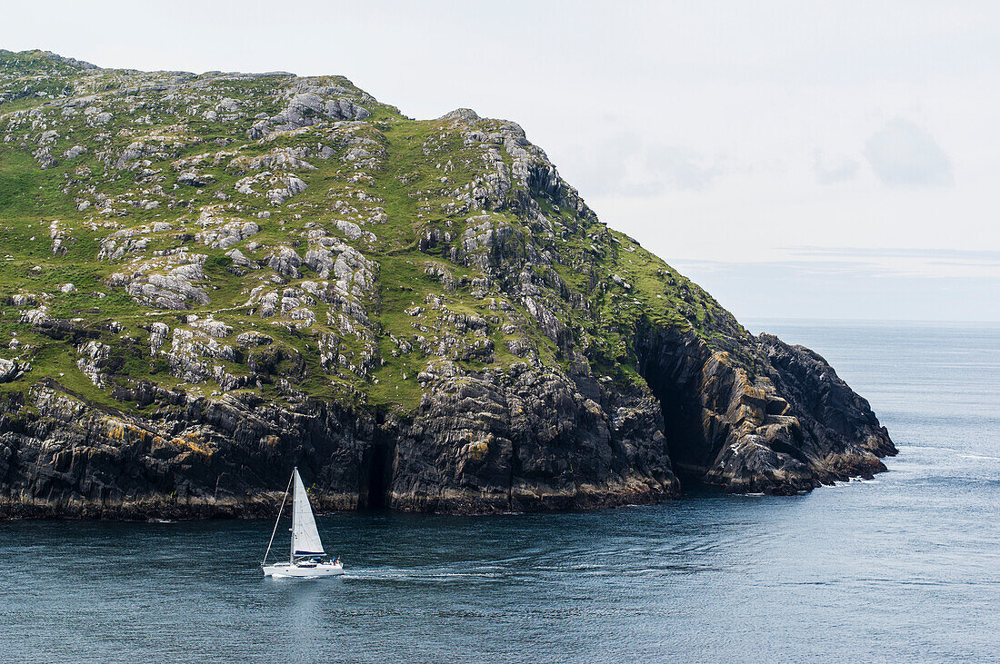 UK,Ireland,County Kerry,Yacht sailing into Dursley Sound