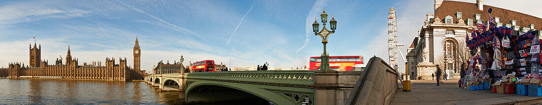 UK,Panoramic view of Houses of Parliament and London Eye from Westminster bridge with London red bus,London