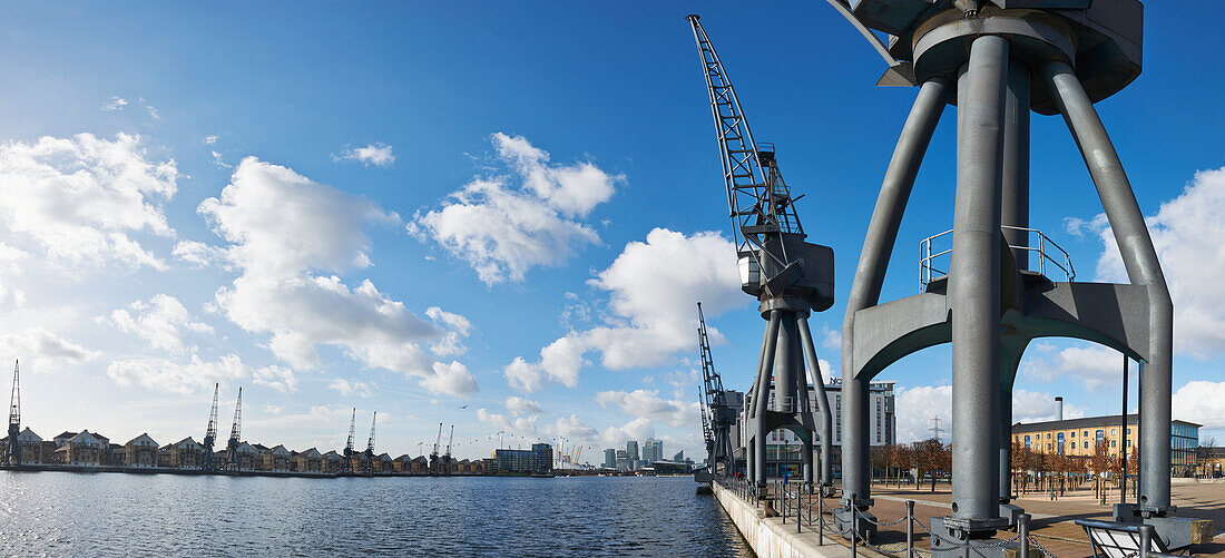 UK,Panoramic view looking towards Canary Wharf from old crane at side of Royal Victoria Docks,London
